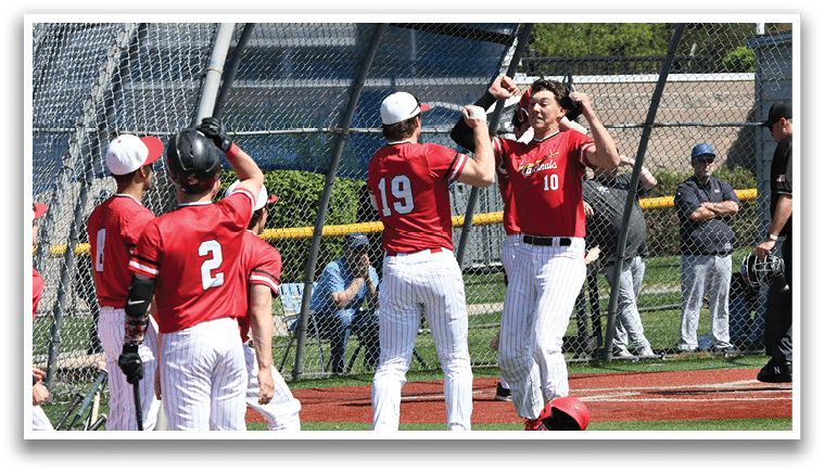 A group of baseball players on a field. Description generated by AI