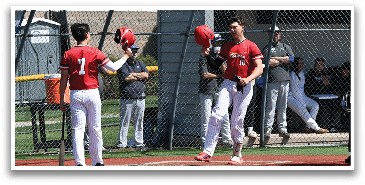 Baseball players on a field. Description generated by AI