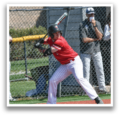 A baseball player in a red shirt and white pants is swinging a bat. Description generated by AI