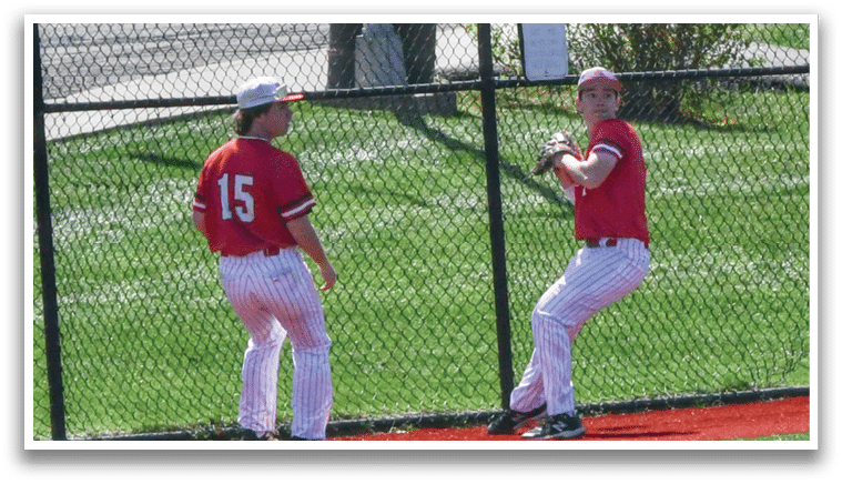 Two men playing baseball. Description generated by AI