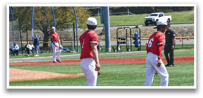 A baseball field with three players walking on it. Description generated by AI