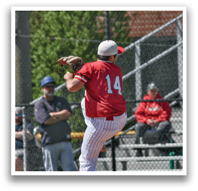 A baseball player in a red shirt and white pants is throwing a ball. Description generated by AI