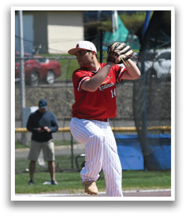 A baseball player in a red shirt and white pants is about to throw a ball. Description generated by AI