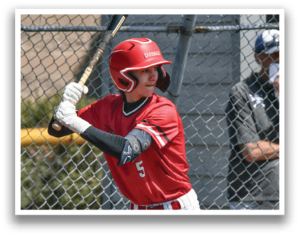 A baseball player in a red and white uniform holding a bat. Description generated by AI