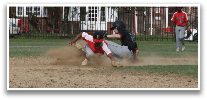 A baseball player slides into a base. Description generated by AI