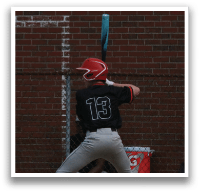 A baseball player is swinging a bat. Description generated by AI
