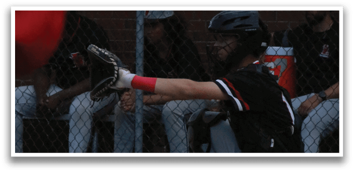 A baseball player is sitting on the ground with his glove on. Description generated by AI