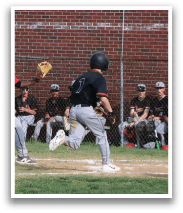 A baseball player is running to first base. Description generated by AI