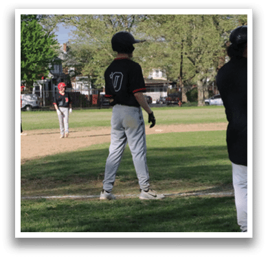A baseball game is taking place on a field. Description generated by AI