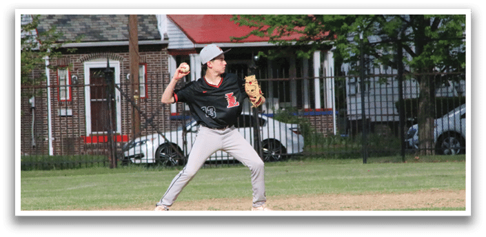 A boy in a black shirt and grey pants is throwing a baseball. Description generated by AI