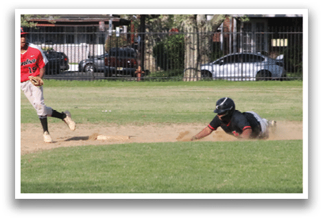 A baseball player sliding into a base. Description generated by AI