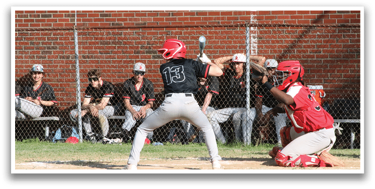 A baseball player is swinging a bat at a ball. Description generated by AI