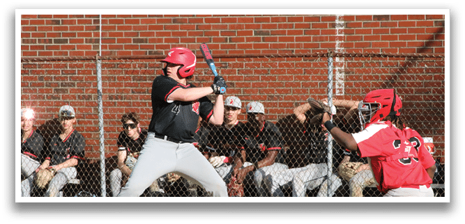 A baseball player is swinging a bat at a ball. Description generated by AI