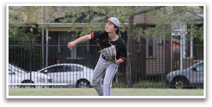 A boy in a black and red shirt is throwing a baseball. Description generated by AI