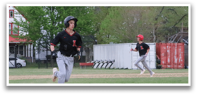 A baseball game is taking place with a player running to a base. Description generated by AI