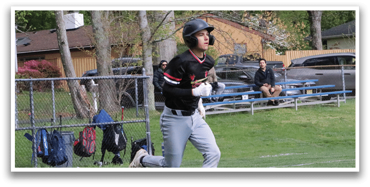 A baseball player running on the field. Description generated by AI