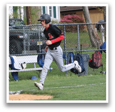 A baseball player running on the field. Description generated by AI