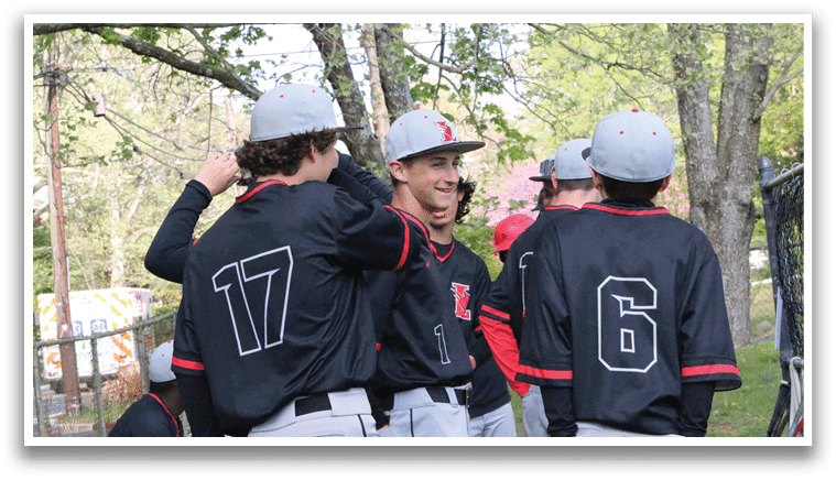 A group of baseball players wearing black shirts and white pants. Description generated by AI