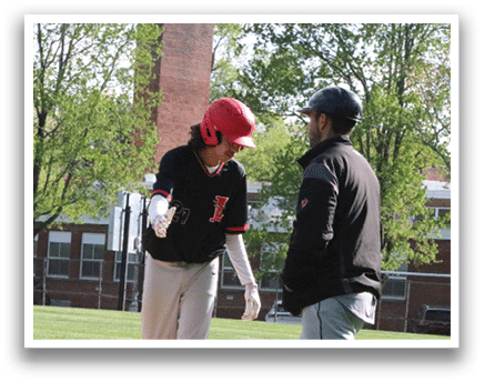 A baseball player is standing on home plate. Description generated by AI