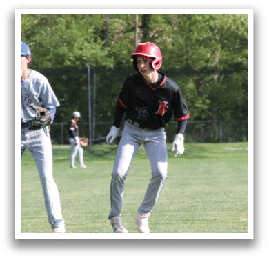 A group of baseball players on a field. Description generated by AI