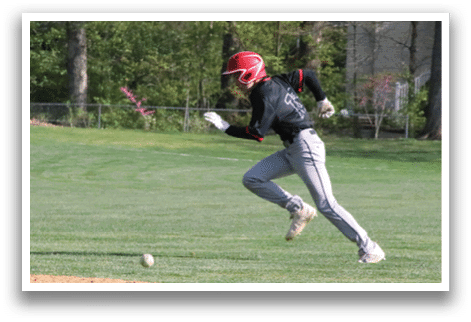 A baseball player is running towards a base. Description generated by AI