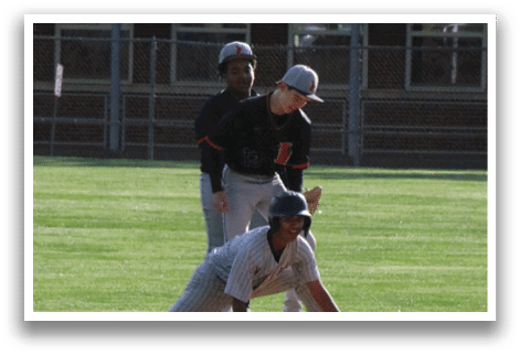 A man is sliding into a base. Description generated by AI