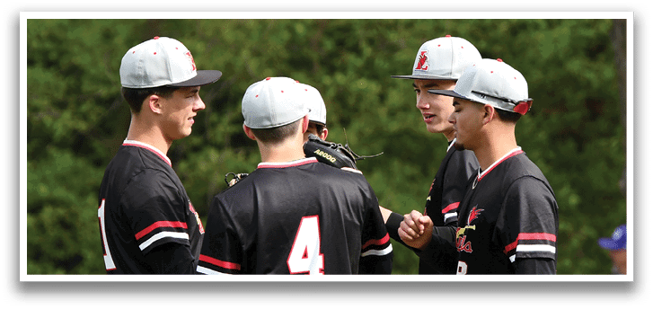 A group of baseball players wearing black and red jerseys. Description generated by AI