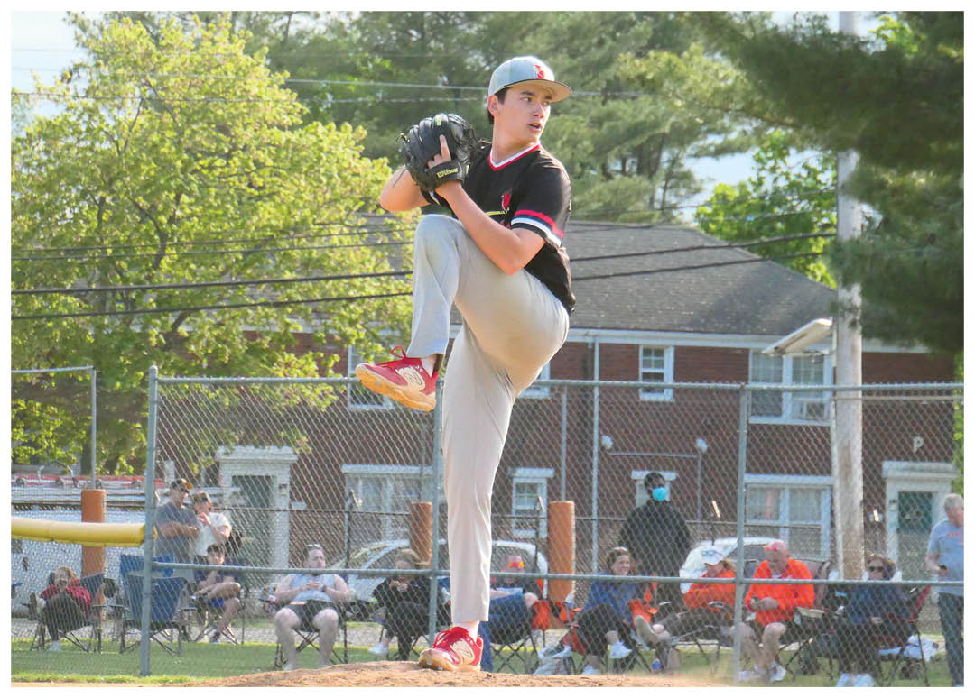 A baseball player is pitching a ball. Description generated by AI