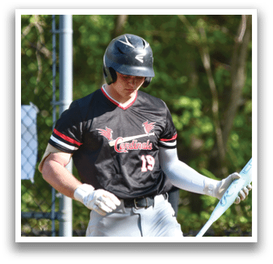 A baseball player holding a bat. Description generated by AI