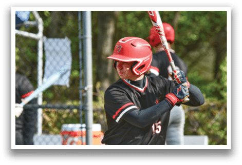 A baseball player holding a bat. Description generated by AI