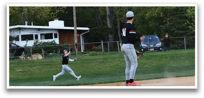 A baseball game is taking place on a field. Description generated by AI