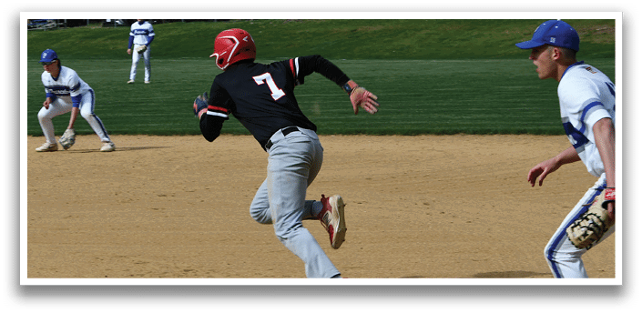 A baseball player running to a base. Description generated by AI