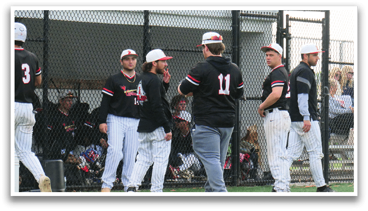 A group of baseball players standing on a field. Description generated by AI