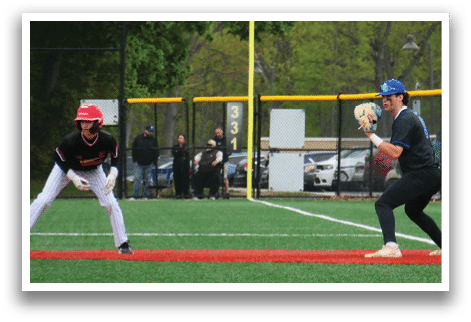 A baseball player in a blue helmet is holding a baseball glove. Description generated by AI