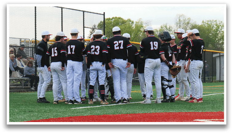 A group of baseball players wearing black and white uniforms. Description generated by AI