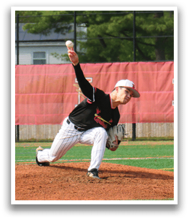 A baseball player in a black shirt and white pants is pitching a ball. Description generated by AI