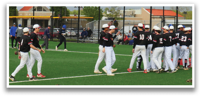 Baseball players on a field. Description generated by AI