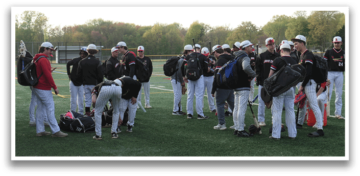 A group of people wearing black and white uniforms. Description generated by AI