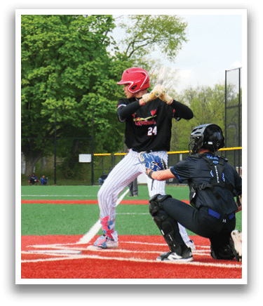 A baseball player is at bat, holding a bat and getting ready to swing. Description generated by AI