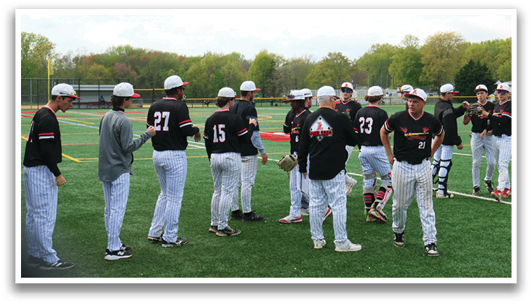 A group of baseball players wearing black and white uniforms. Description generated by AI