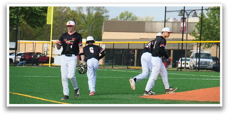 Three baseball players walking on a field. Description generated by AI