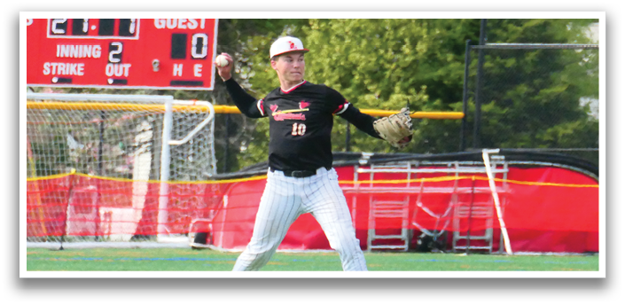 A baseball player in a black shirt and white pants is throwing a ball. Description generated by AI