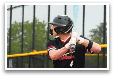 A baseball player in a black shirt and helmet is swinging a bat. Description generated by AI