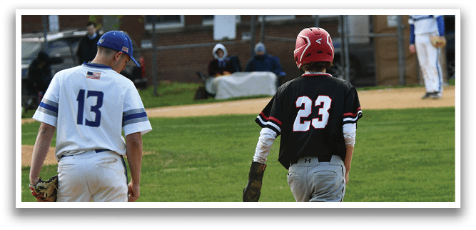 A baseball player wearing a black shirt with the number 23 on it. Description generated by AI