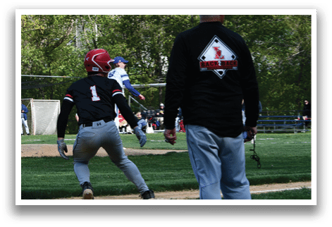 A man wearing a black shirt and a red helmet. Description generated by AI