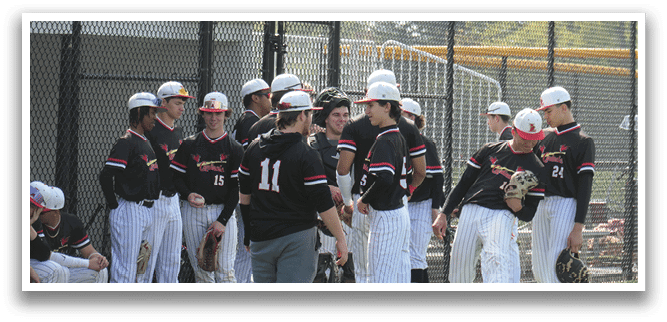 A group of baseball players wearing black and white uniforms. Description generated by AI