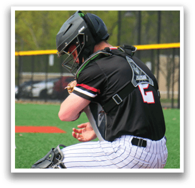 A baseball player kneeling on the field. Description generated by AI