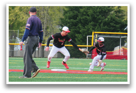 A baseball player is sliding into a base. Description generated by AI