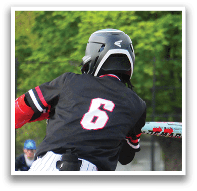 A baseball player wearing a black shirt with the number 6 on it. Description generated by AI