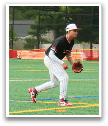A baseball player in a black shirt and white pants is catching a ball. Description generated by AI